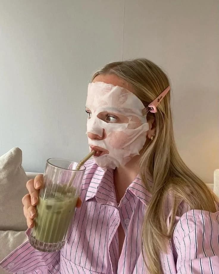 A quiet moment with a face mask and a green drink
